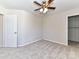 Bedroom with ceiling fan and closet at 7780 Orchard Park Cir, Harrisburg, NC 28075