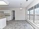 Kitchen with granite countertops and white cabinets at 7780 Orchard Park Cir, Harrisburg, NC 28075