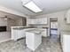 Kitchen with white cabinets, granite countertops, and island at 7780 Orchard Park Cir, Harrisburg, NC 28075