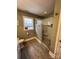 Modern bathroom featuring a walk-in shower with pebble floor and tiled walls at 7925 Tottenham Dr, Harrisburg, NC 28075