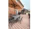 Spacious deck with patio furniture, umbrella, and built-in grill at 7925 Tottenham Dr, Harrisburg, NC 28075