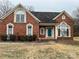 Attractive brick home with landscaping and a well-maintained lawn at 7925 Tottenham Dr, Harrisburg, NC 28075