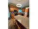 Kitchen with oak cabinets, granite countertops, and an island at 7925 Tottenham Dr, Harrisburg, NC 28075