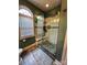 Large walk-in shower with pebble floor and glass enclosure at 7925 Tottenham Dr, Harrisburg, NC 28075