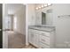 Bathroom with granite countertop, white cabinets, and tiled floor at 820 Bethesda Rd, Statesville, NC 28677