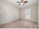 Bright bedroom with neutral walls and carpet flooring at 820 Bethesda Rd, Statesville, NC 28677