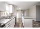 Spacious kitchen with granite countertops and stainless steel appliances at 820 Bethesda Rd, Statesville, NC 28677