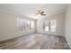 Bright living room with large windows and vinyl flooring at 820 Bethesda Rd, Statesville, NC 28677