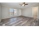 Living room featuring vinyl flooring and ceiling fan at 820 Bethesda Rd, Statesville, NC 28677