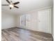 Living room with vinyl plank flooring and ceiling fan at 820 Bethesda Rd, Statesville, NC 28677