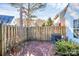 Private backyard patio with wooden fence and landscaping at 8927 Bryant Field Cir, Charlotte, NC 28277