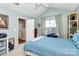 Bright bedroom with a double bed and access to the backyard at 8927 Bryant Field Cir, Charlotte, NC 28277