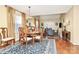 Formal dining room with hardwood floors and chandelier at 8927 Bryant Field Cir, Charlotte, NC 28277