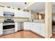 White cabinets, granite countertops, and stainless steel appliances in kitchen at 8927 Bryant Field Cir, Charlotte, NC 28277