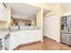 White kitchen with granite countertops and stainless steel appliances at 8927 Bryant Field Cir, Charlotte, NC 28277