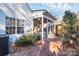 Home exterior showcasing a screened porch and brick patio area at 8927 Bryant Field Cir, Charlotte, NC 28277