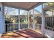 Relaxing screened porch with brick flooring and view of backyard at 8927 Bryant Field Cir, Charlotte, NC 28277