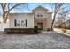 Two-story townhome with stone accents and a landscaped yard at 9112 Meadowmont View Dr, Charlotte, NC 28269