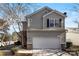 Two-story house with gray siding, attached garage, and landscaping at 9112 Meadowmont View Dr, Charlotte, NC 28269