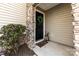 Inviting front entry with a black door and stone accents at 9112 Meadowmont View Dr, Charlotte, NC 28269