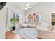 Living area with L-shaped sofa and hardwood floors at 9112 Meadowmont View Dr, Charlotte, NC 28269