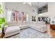 Spacious living room featuring a large sectional sofa and high ceilings at 9112 Meadowmont View Dr, Charlotte, NC 28269