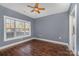 Bedroom with hardwood floor, window, and ceiling fan at 9261 Meadow Vista Rd, Charlotte, NC 28213