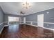 Living room with hardwood floors and patio access at 9261 Meadow Vista Rd, Charlotte, NC 28213