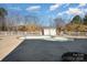 Kidney-shaped community pool with surrounding fence at 9261 Meadow Vista Rd, Charlotte, NC 28213