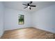 Bright bedroom with light hardwood floors and large window at Lot 1 Hoke W St, Landis, NC 28088