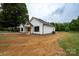 White house with black windows, wood columns, and a spacious front yard at Lot 1 Hoke W St, Landis, NC 28088