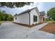 White house with black windows, concrete driveway, and landscaping at Lot 1 Hoke W St, Landis, NC 28088