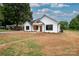 Newly built home with white exterior and a long driveway at Lot 1 Hoke W St, Landis, NC 28088