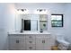 Clean bathroom with double vanity, quartz countertops and contemporary lighting at Lot 1 Sloop St, China Grove, NC 28023