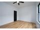 Bright bedroom with light hardwood floors and a modern black door at Lot 1 Sloop St, China Grove, NC 28023