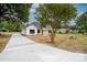 New construction home with a long driveway leading to the front entrance at Lot 1 Sloop St, China Grove, NC 28023