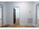 Clean hallway bathroom with light hardwood floors and a white tile shower at Lot 1 Sloop St, China Grove, NC 28023