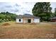 Newly constructed home with white siding, gray roof, and a covered porch at Lot 1 Sloop St, China Grove, NC 28023