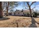 Spacious backyard with large trees and screened porch at 10512 Roseberry Ct, Charlotte, NC 28277