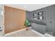 Modern bar area with wood and gray slatted wall accents, and built-in shelving at 10512 Roseberry Ct, Charlotte, NC 28277