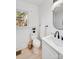 Clean bathroom with white vanity, a toilet, and a window at 10512 Roseberry Ct, Charlotte, NC 28277