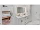 Double vanity bathroom with marble countertops and modern fixtures at 10512 Roseberry Ct, Charlotte, NC 28277