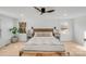 Bright bedroom with wood bed frame and natural light at 10512 Roseberry Ct, Charlotte, NC 28277