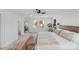 Bright bedroom with large windows, a king-size bed, and a full-length mirror at 10512 Roseberry Ct, Charlotte, NC 28277