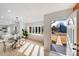 Bright dining room with an open view to the front yard, and a modern dining table at 10512 Roseberry Ct, Charlotte, NC 28277