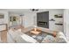 Bright living room with modern fireplace and light hardwood floors at 10512 Roseberry Ct, Charlotte, NC 28277