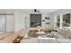 Bright living room with a modern fireplace, large windows, and sectional sofa at 10512 Roseberry Ct, Charlotte, NC 28277