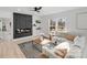 Living room with a modern fireplace and sectional sofa at 10512 Roseberry Ct, Charlotte, NC 28277
