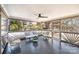 Cozy screened porch with seating area and backyard view at 10512 Roseberry Ct, Charlotte, NC 28277