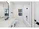 Modern bathroom with white subway tile and a soaking tub at 10605 S Hampton Dr, Charlotte, NC 28227